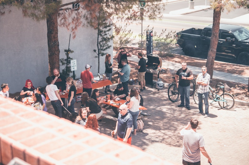 an outdoor party with folks casually chatting